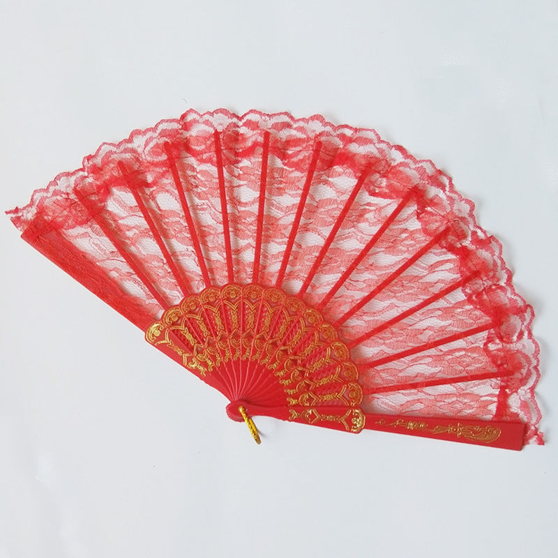 Women's fan made of fine lace with elegant gold embellishment