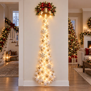 Christmas bell wall light above a tall sparkling holiday trail